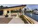 Outdoor kitchen and bar area with a built-in grill and bar seating, perfect for entertaining by the pool at 8520 E Cactus Wren Rd, Scottsdale, AZ 85250