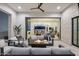 Inviting outdoor living space with a fire pit, plush seating, and views of the beautifully designed interior at 8520 E Cactus Wren Rd, Scottsdale, AZ 85250