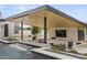 Poolside pavilion includes an outdoor kitchen, bar, and seating area, great for entertaining at 8520 E Cactus Wren Rd, Scottsdale, AZ 85250