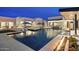 Wide shot of the pool area with many features including a lounge area, hot tub and fire feature at 8520 E Cactus Wren Rd, Scottsdale, AZ 85250