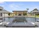 Stunning pool features a unique water feature, adjacent pool house and pristine landscaping at 8520 E Cactus Wren Rd, Scottsdale, AZ 85250
