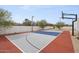 Multi-use sport court for tennis or basketball featuring professional grade equipment at 8520 E Cactus Wren Rd, Scottsdale, AZ 85250