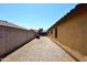 Gravel-covered side yard providing additional outdoor space for various activities at 10628 W Country Club Trl, Peoria, AZ 85383