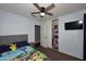 This cute bedroom has an entertainment center, closet and Paw Patrol bedding at 10628 W Country Club Trl, Peoria, AZ 85383