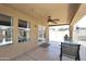 View of a covered patio with a table and chairs, showcasing outdoor living space at 10628 W Country Club Trl, Peoria, AZ 85383