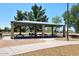Community picnic area with shade structure and multiple tables, perfect for outdoor gatherings and meals at 10628 W Country Club Trl, Peoria, AZ 85383