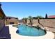Sparkling pool with waterfalls and mature palm trees at 10628 W Country Club Trl, Peoria, AZ 85383
