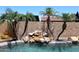 Beautiful sparkling swimming pool with a rock waterfall feature at 10628 W Country Club Trl, Peoria, AZ 85383