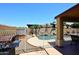 Backyard featuring a pool and a grilling area at 10628 W Country Club Trl, Peoria, AZ 85383