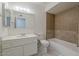 Bathroom showcasing a vanity, bathtub, shower, and a well-lit mirror at 10655 E Broadway Rd, Mesa, AZ 85208