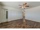 Bedroom with laminate flooring, closet and ensuite bathroom at 10655 E Broadway Rd, Mesa, AZ 85208