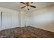 Neutral bedroom with wood flooring, ceiling fan, and closet at 10655 E Broadway Rd, Mesa, AZ 85208