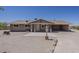 Inviting single-story home features desert landscaping and a covered front porch entrance at 10655 E Broadway Rd, Mesa, AZ 85208