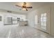 Bright kitchen featuring white cabinets, stainless steel appliances, and large tile flooring at 10655 E Broadway Rd, Mesa, AZ 85208