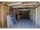 A view of the shed interior showcasing wooden walls and flooring along with ample space at 10655 E Broadway Rd, Mesa, AZ 85208