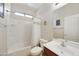 Bright bathroom with a shower-tub combo and a modern vanity at 1141 W Stephanie Ln, San Tan Valley, AZ 85143