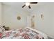 Bright bedroom with a ceiling fan and wall art in a cozy setting at 1141 W Stephanie Ln, San Tan Valley, AZ 85143