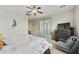 Comfortable bedroom featuring a ceiling fan, sliding doors to patio, dresser, and chair at 1141 W Stephanie Ln, San Tan Valley, AZ 85143