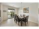 Dining room with a large glass door that gives views to the backyard swimming pool at 1141 W Stephanie Ln, San Tan Valley, AZ 85143