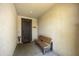 Covered entryway featuring a decorative security door and bench at 1141 W Stephanie Ln, San Tan Valley, AZ 85143