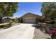 Charming single-story home featuring a well-manicured front yard and a spacious two-car garage at 1141 W Stephanie Ln, San Tan Valley, AZ 85143