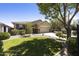 Charming single-story home featuring a well-manicured front yard and a spacious two-car garage at 1141 W Stephanie Ln, San Tan Valley, AZ 85143