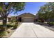Charming single-story home featuring a well-manicured front yard and a spacious two-car garage at 1141 W Stephanie Ln, San Tan Valley, AZ 85143