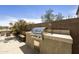 Outdoor kitchen with built-in grill and counter space, perfect for entertaining at 1141 W Stephanie Ln, San Tan Valley, AZ 85143