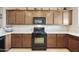 Well-equipped kitchen showcasing stainless appliances, granite countertops, and ample cabinet space at 1141 W Stephanie Ln, San Tan Valley, AZ 85143