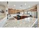 Modern kitchen featuring granite countertops, stainless steel appliances, and ample cabinet space at 1141 W Stephanie Ln, San Tan Valley, AZ 85143