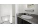 Bathroom features a modern vanity with granite countertop and stainless steel faucet at 11640 N 51St Ave # 211, Glendale, AZ 85304