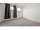 Bright bedroom with ample natural light and carpet flooring at 11640 N 51St Ave # 211, Glendale, AZ 85304