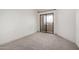 Bedroom with neutral carpet and sliding glass doors to private patio for fresh air at 11640 N 51St Ave # 211, Glendale, AZ 85304