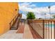 The community pool area is accessible via stairs and surrounded by desert landscaping at 11640 N 51St Ave # 211, Glendale, AZ 85304