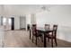 Open floor plan with a dining area leading to the living room and a view of the balcony at 11640 N 51St Ave # 211, Glendale, AZ 85304