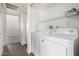 Laundry room has a washer and dryer, plus an overhead storage shelf at 11640 N 51St Ave # 211, Glendale, AZ 85304