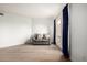Bright, airy living room with wood-look flooring, neutral paint, and a comfortable couch at 11640 N 51St Ave # 211, Glendale, AZ 85304