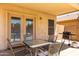 Outdoor patio with patio furniture and a grill at 11841 W Laurel Ln, El Mirage, AZ 85335