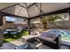 Inviting backyard with a covered patio, comfortable seating and a refreshing pool at 12814 W Edgemont Ave, Avondale, AZ 85392