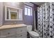 Bathroom with a vanity, toilet, combination shower and tub, and neutral paint at 12814 W Edgemont Ave, Avondale, AZ 85392