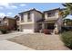 Beautiful two-story home with stucco siding, a two-car garage, and low-maintenance desert landscaping at 12814 W Edgemont Ave, Avondale, AZ 85392