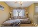 Cozy upstairs living area with couch, neutral tones, and great natural light at 12814 W Edgemont Ave, Avondale, AZ 85392