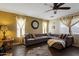 Comfortable living room featuring a plush sectional couch and bright, natural light at 12814 W Edgemont Ave, Avondale, AZ 85392