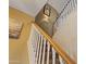 Carpeted staircase with white railing offers a classic and clean design at 12814 W Edgemont Ave, Avondale, AZ 85392
