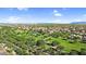 Expansive aerial shot revealing a sprawling neighborhood with a central park and tree-lined streets at 13131 N 153Rd Ave, Surprise, AZ 85379