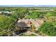 Aerial view of a large home in a community with beautiful landscaping, walking path, and green grass at 13131 N 153Rd Ave, Surprise, AZ 85379