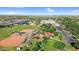 Aerial view of community baseball fields, playground, school, and solar panels in a Gathering-friendly neighborhood at 13131 N 153Rd Ave, Surprise, AZ 85379