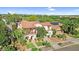Stunning aerial view of a two-story home featuring mature trees, a tile roof, and solar panels at 13131 N 153Rd Ave, Surprise, AZ 85379