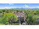 Aerial view of a beautiful home with a pool, lush landscaping, and mountain views at 13131 N 153Rd Ave, Surprise, AZ 85379
