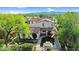 Aerial view of a lovely property featuring a backyard pool, patio, and lush landscaping at 13131 N 153Rd Ave, Surprise, AZ 85379